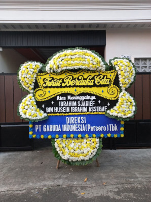 Papan Bunga Duka di Beo