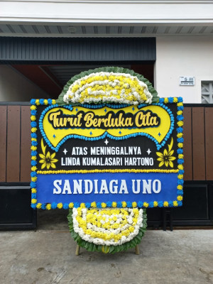 Papan Bunga Duka di Beo
